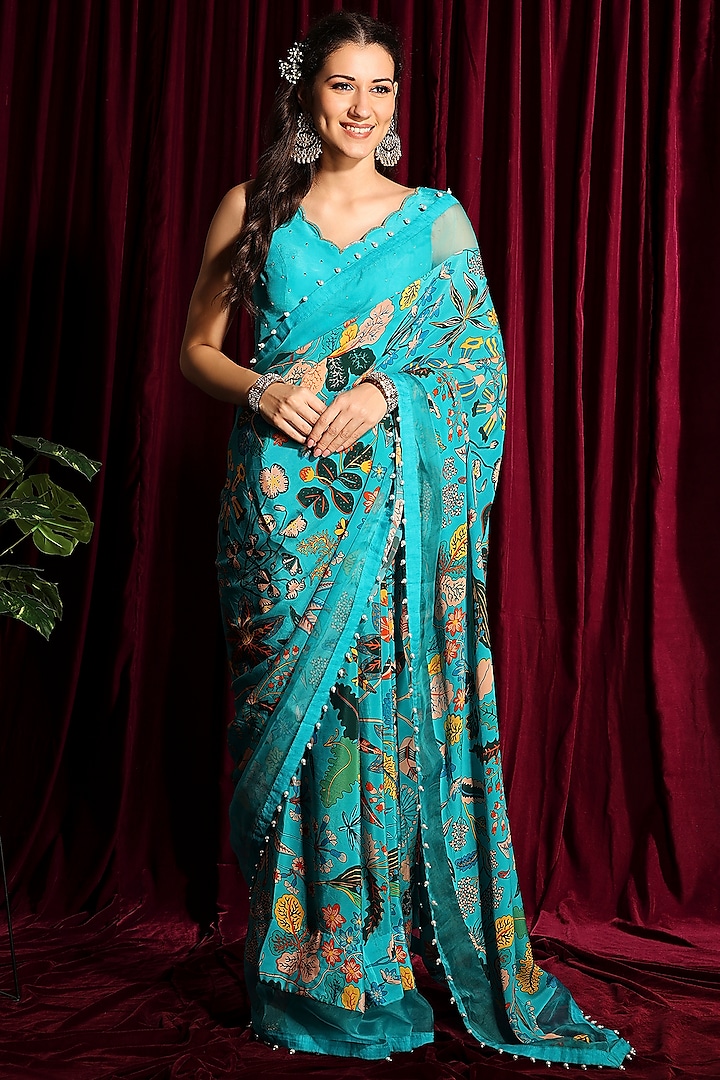 Fluorescent Turquoise Crepe Silk Printed & Embroidered Saree Set
 by Aayushi Maniar