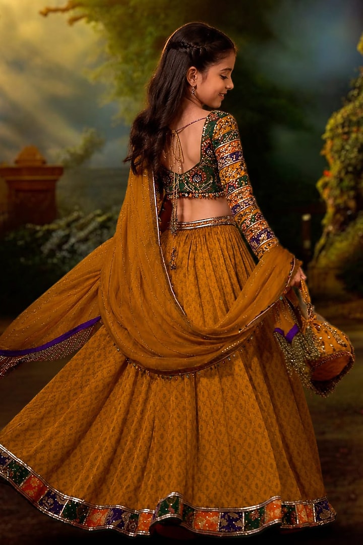 Mustard Yellow Tussar Silk Hand Embroidered Lehenga Set For Girls by Aayushi Maniar Kids at Pernia's Pop Up Shop