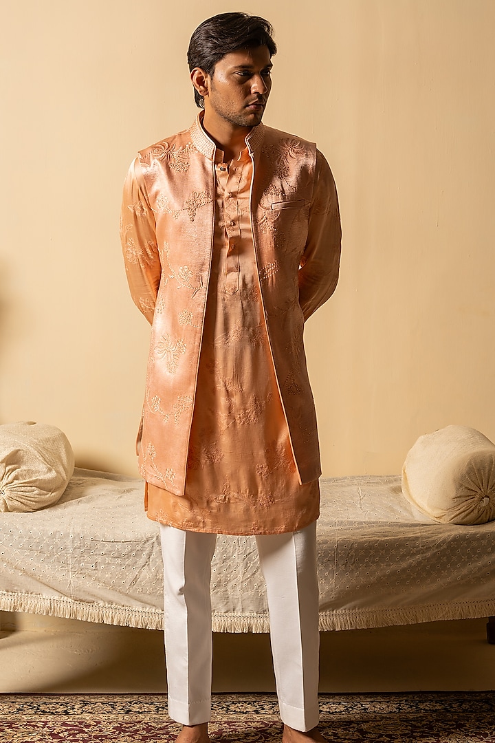 Peach Satin Silk Floral Hand Embroidered Bundi Jacket by AYUSH JAIN