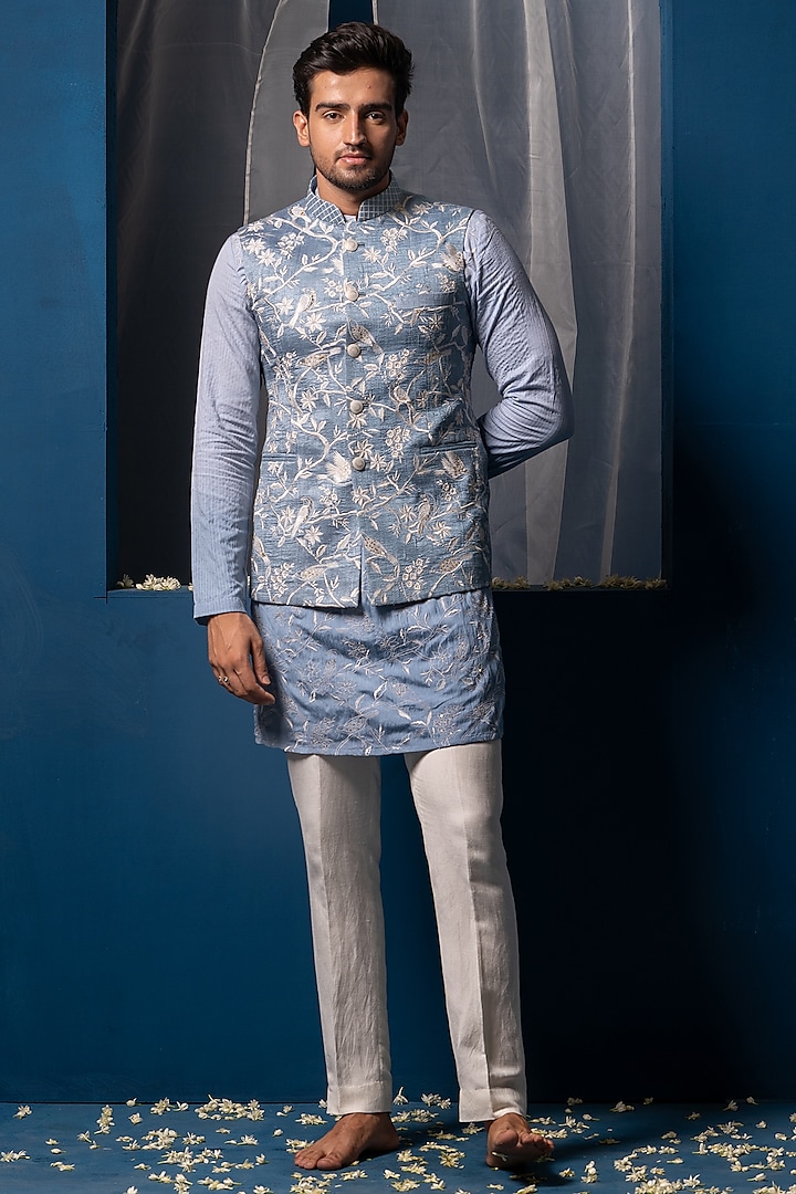 Blue Silk Floral Hand Embroidered Bundi Jacket by AYUSH JAIN