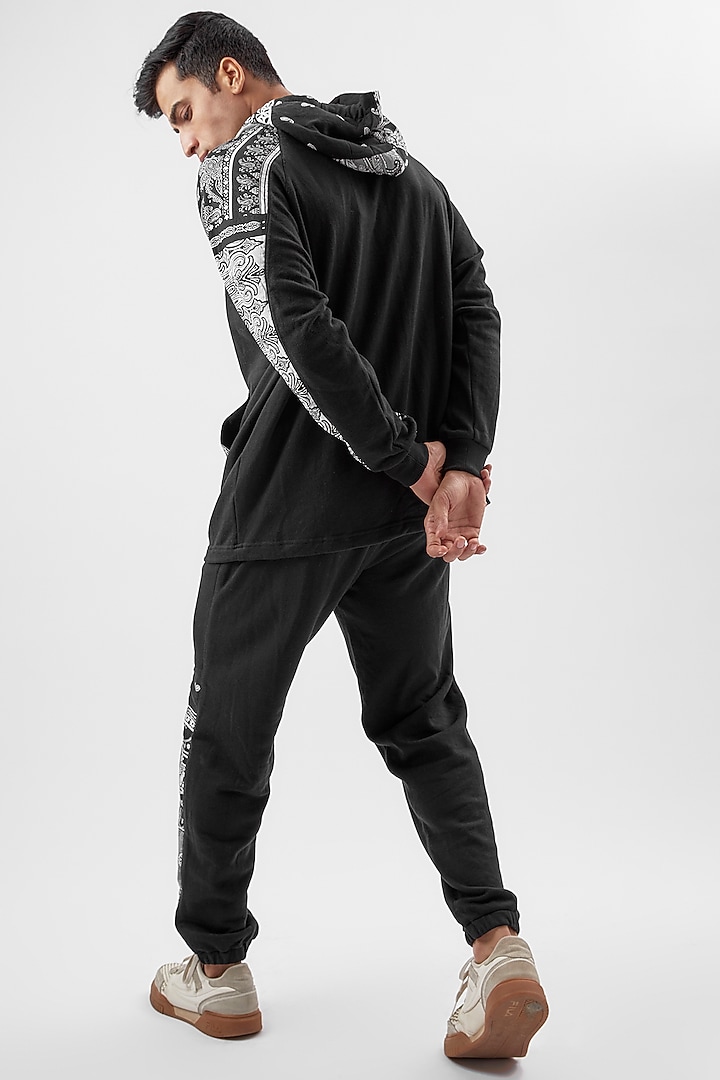 Black Cotton Paisley Printed Jogger Pants by BACK ALLEY BODEGA at Pernia's Pop Up Shop