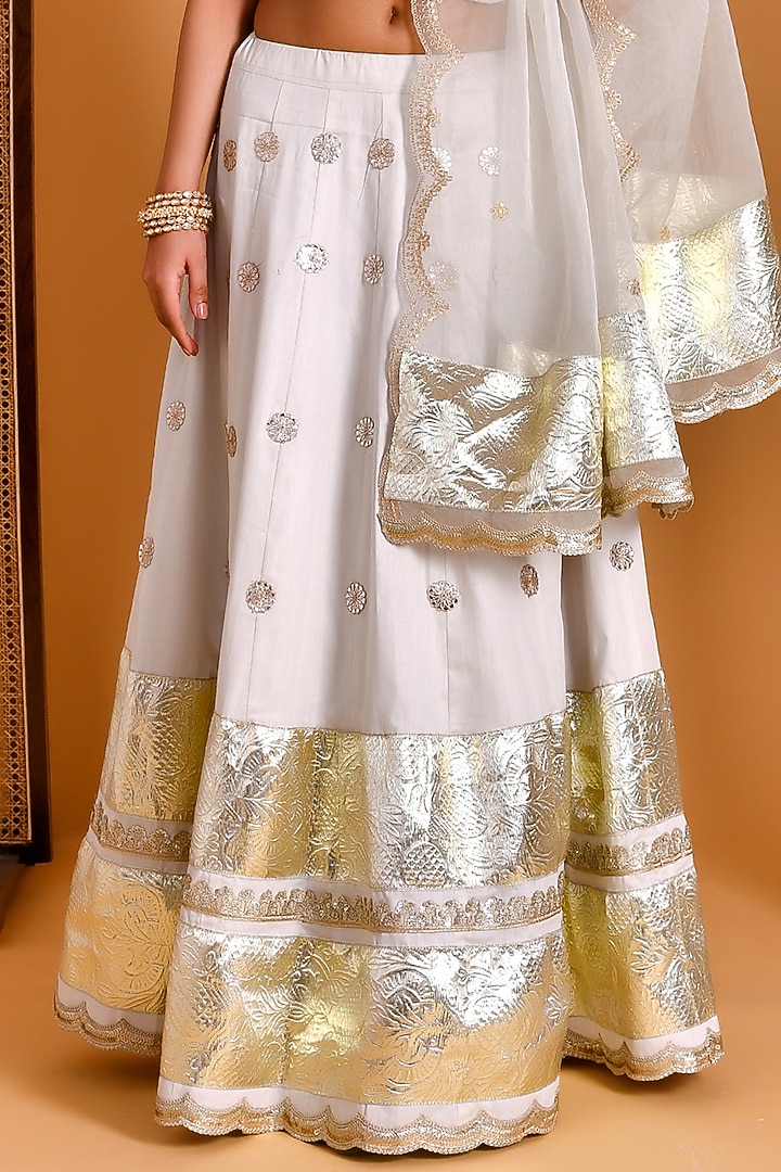White Cotton Silk & Georgette Sequins Hand Embroidered Wedding Lehenga Set by Bannhi by Priyanka Rathore at Pernia's Pop Up Shop