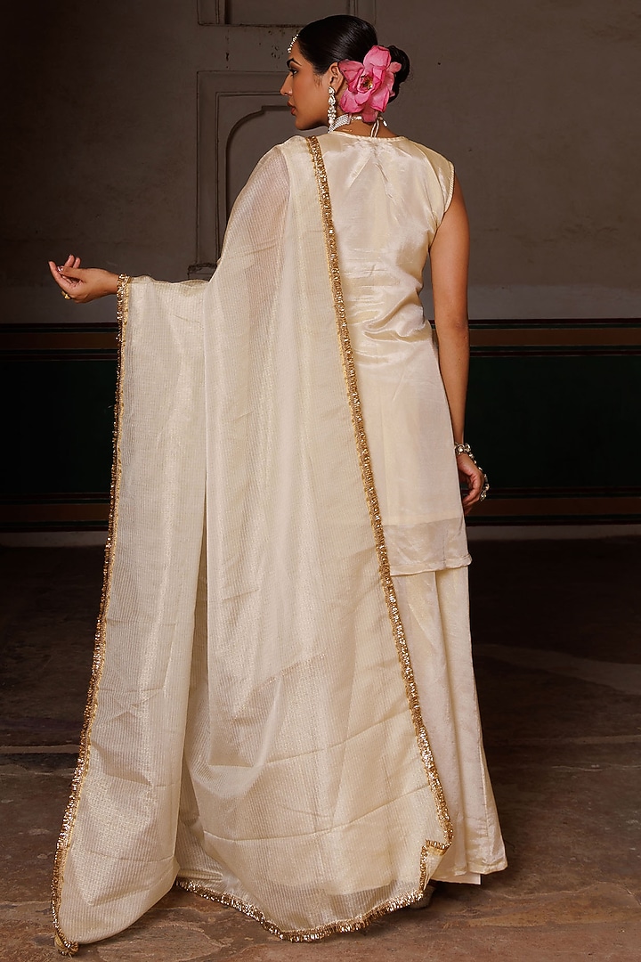 Ivory & Gold Tissue Party Wear Sharara Set by Bannhi by Priyanka Rathore at Pernia's Pop Up Shop
