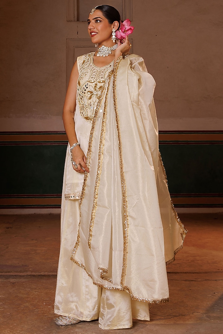Ivory & Gold Tissue Party Wear Sharara Set by Bannhi by Priyanka Rathore at Pernia's Pop Up Shop