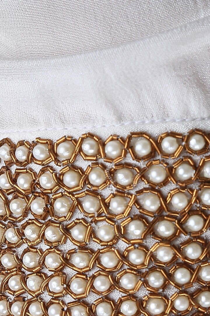 White pearl embroidered crop top with peach floral handpainted sharara pants available only at Pernia's Pop Up Shop.