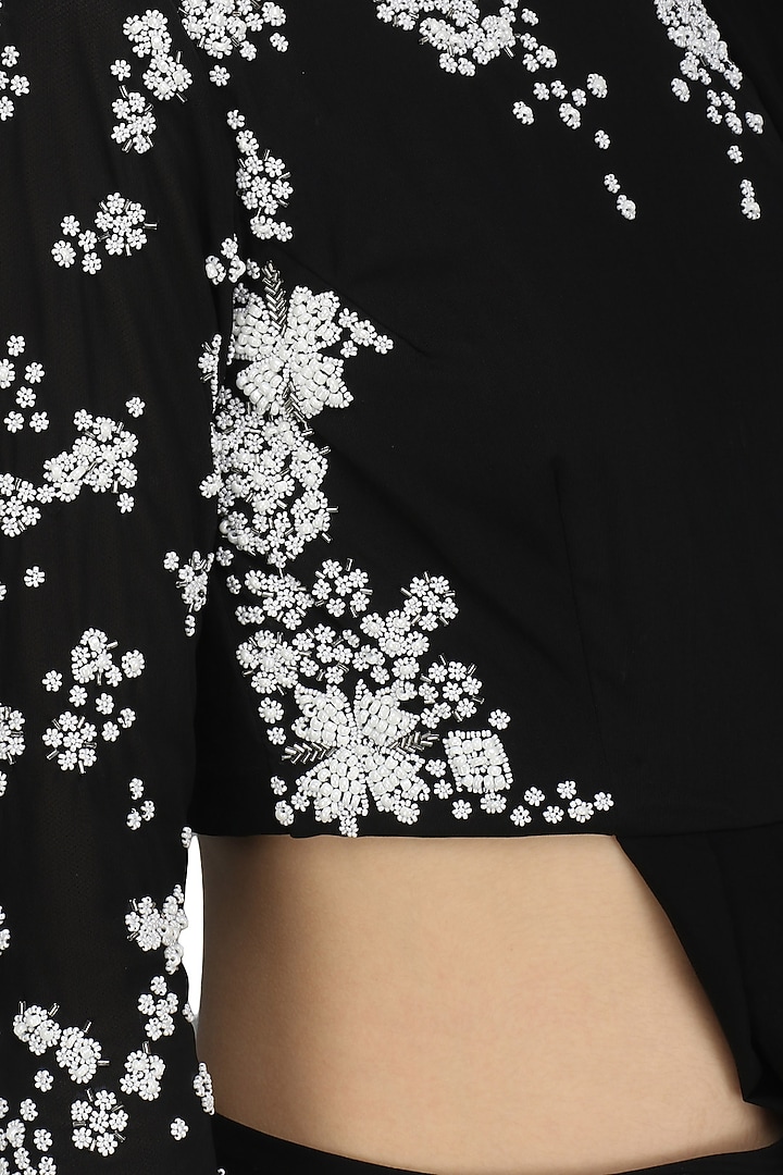 Black pre-stitched drape saree with beaded crop top set available only at Pernia's Pop Up Shop.