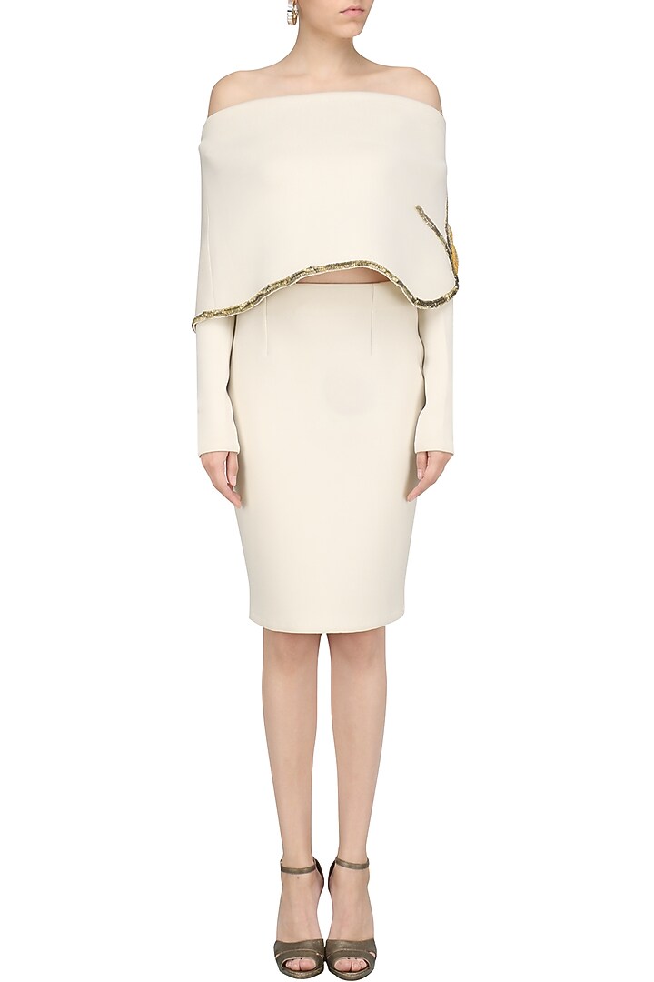 Cream off-shoulder embroidered cape and fitted skirt available only at Pernia's Pop Up Shop.