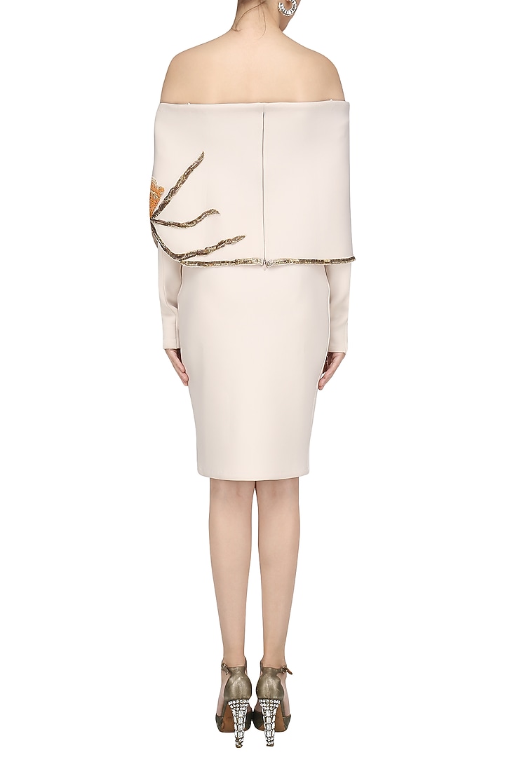 Cream off-shoulder embroidered cape and fitted skirt available only at Pernia's Pop Up Shop.