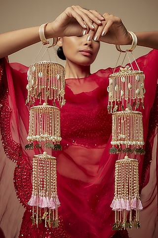 Gold Finish Shell & Charm Layered Kaleeras (Set Of 2) by Beabhika