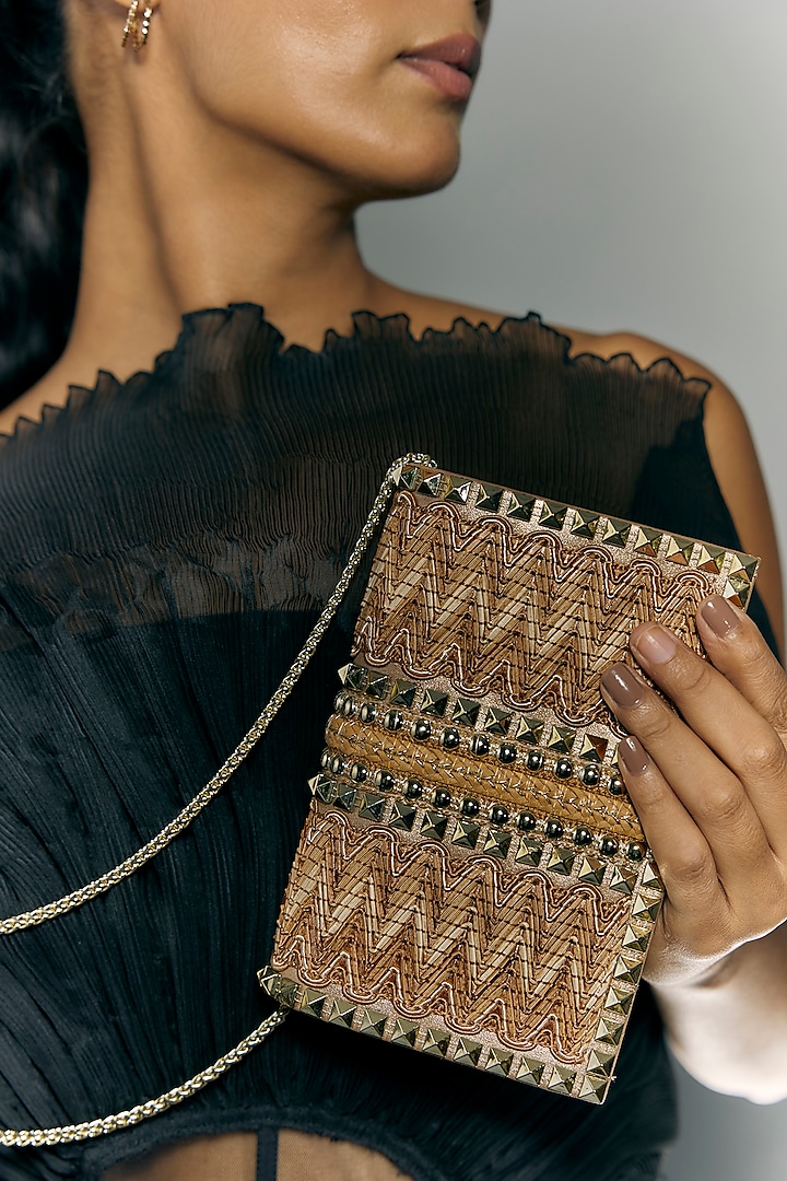 Jute Beige Faux Leather Metal Stud Lace Clutch by BEAU MONDE at Pernia's Pop Up Shop