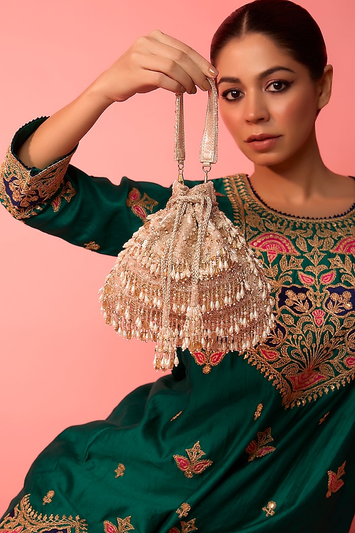 Champagne Gold Vegan Leather Tasseled Potli Bag by BEAU MONDE at Pernia's Pop Up Shop