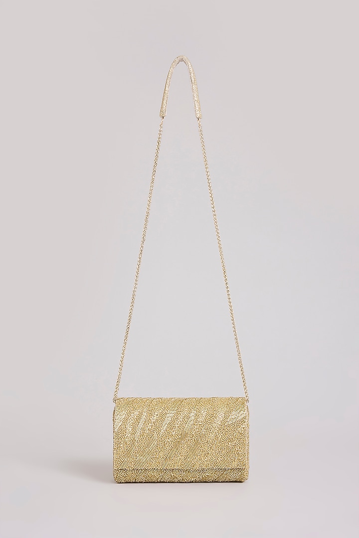 Gold Shimmer Faux Leather Clutch by BEAU MONDE at Pernia's Pop Up Shop