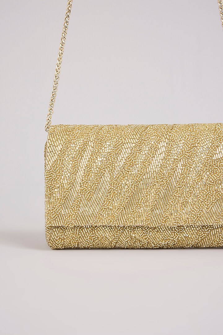 Gold Shimmer Faux Leather Clutch by BEAU MONDE at Pernia's Pop Up Shop