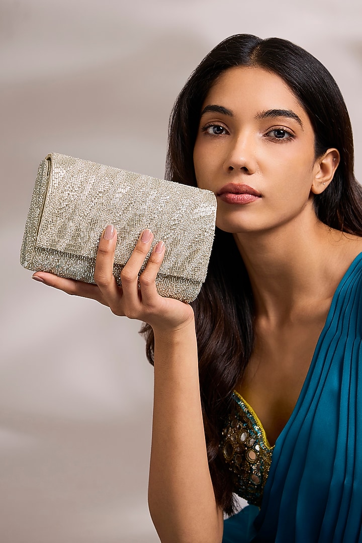 Silver Shimmer Faux Leather Clutch by BEAU MONDE at Pernia's Pop Up Shop