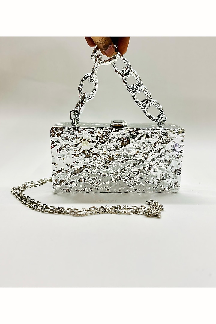 Silver Plastic Clutch by Be Chic at Pernia's Pop Up Shop