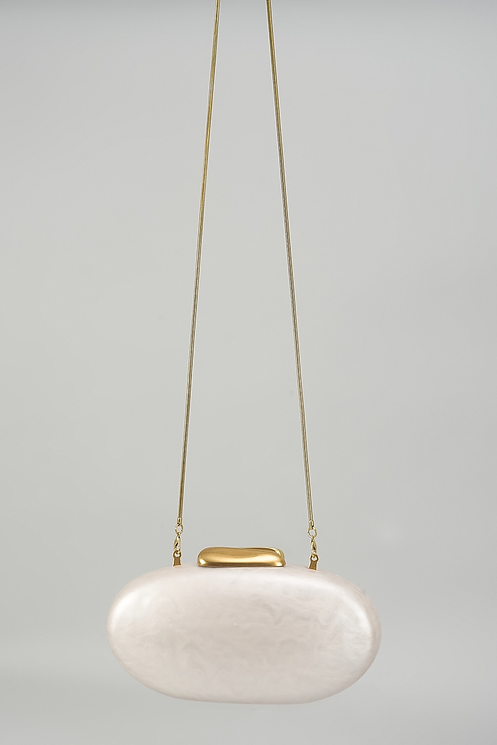 Ivory Resin & Suede Oval Clutch by Be Chic at Pernia's Pop Up Shop