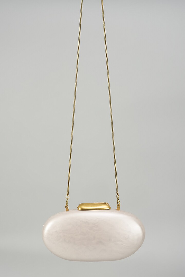Ivory Resin & Suede Oval Clutch by Be Chic at Pernia's Pop Up Shop