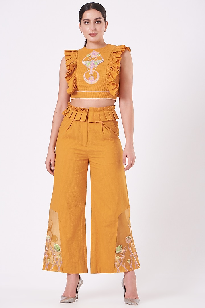 Yellow Embroidered Flared Pants by Beejoliyo