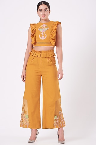 Yellow Embroidered Flared Pants by Beejoliyo