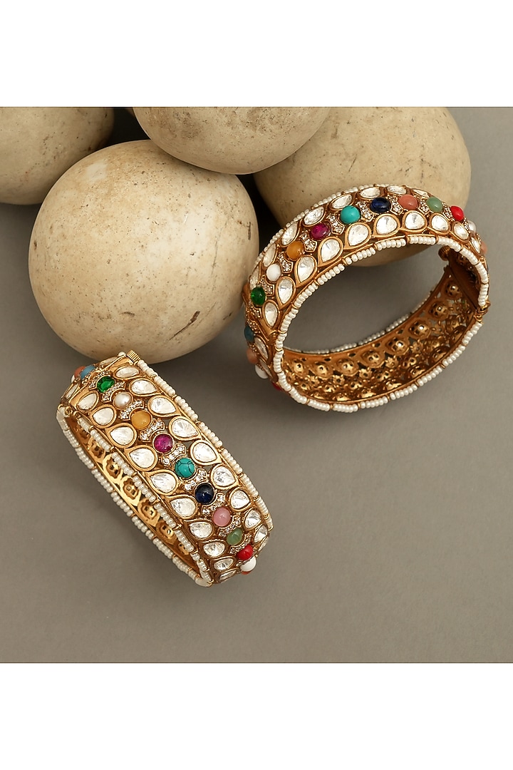 Gold Plated Moissanite Polki & Navratna Stone Openable Bangles (Set Of 2) by Beryachi at Pernia's Pop Up Shop