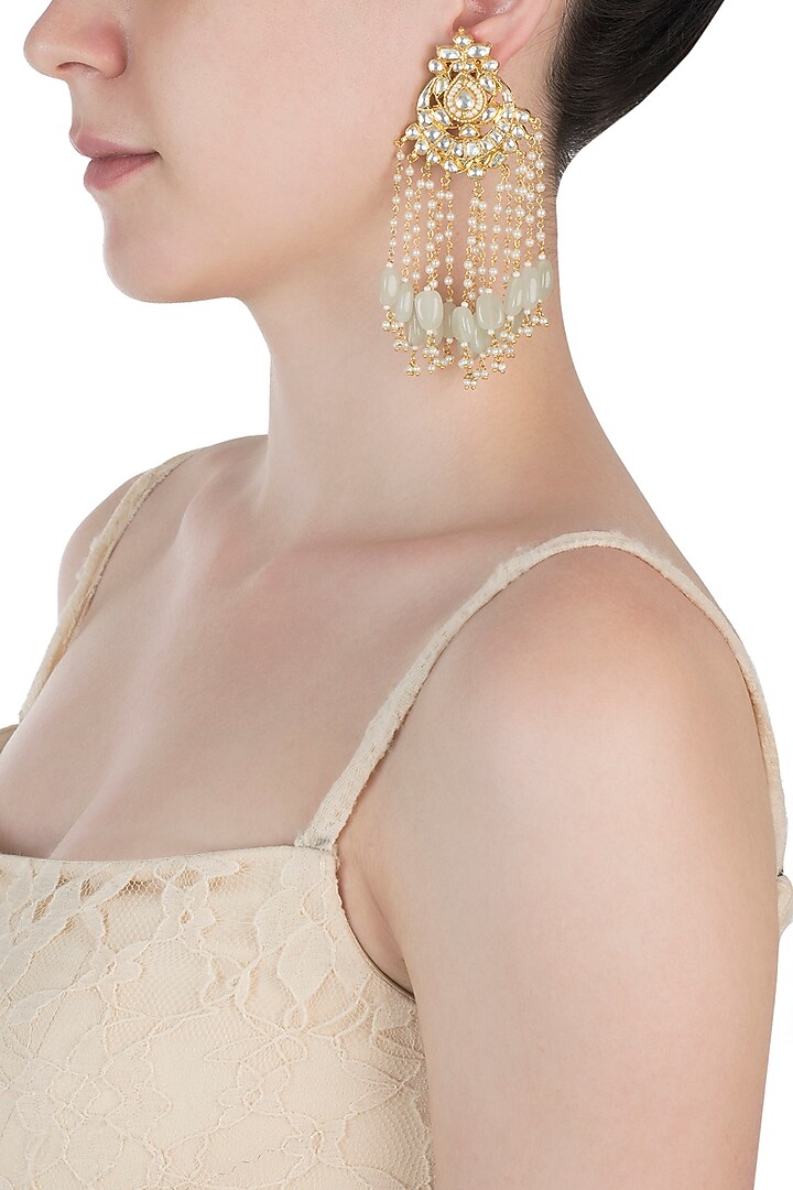 Gold plated kundan and mint green beaded tassel earrings available only at Pernia's Pop Up Shop.