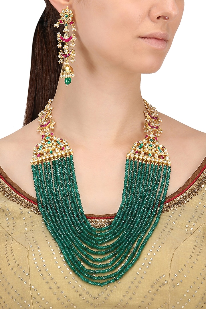 Gold finish kundan and emerald multi-strand necklace set available only at Pernia's Pop Up Shop.