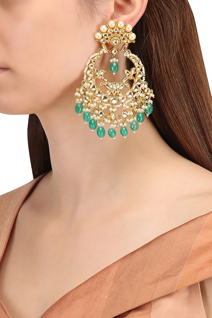 Gold finish kundan, gold pearl and green moti chandbali earrings available only at Pernia's Pop Up Shop.