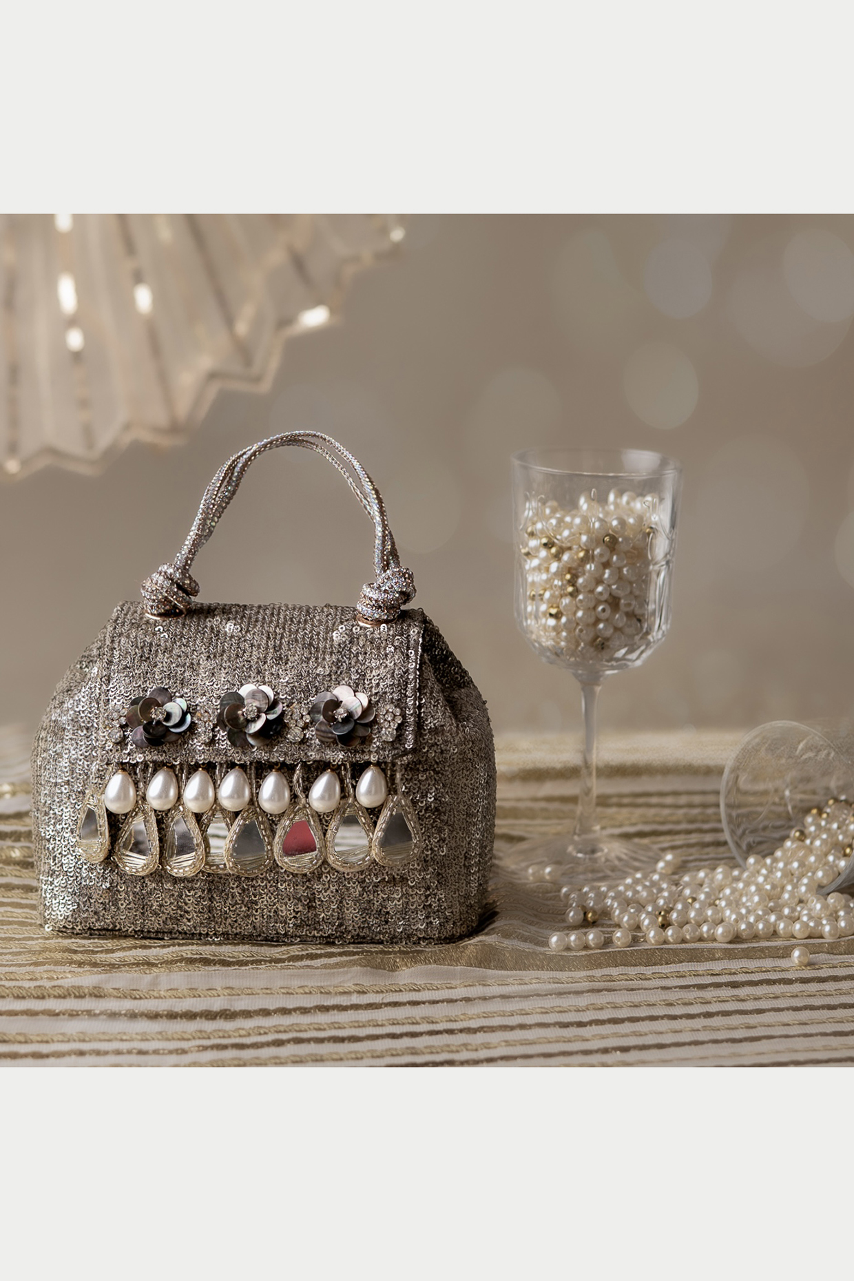 Dull Silver Sequinned Net Embroidered Clutch by BHAVNA KUMAR at Pernia's Pop Up Shop