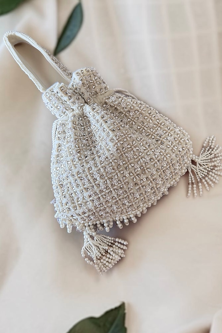 White Faux Silk Hand Embroidered Potli by BHAVNA KUMAR at Pernia's Pop Up Shop