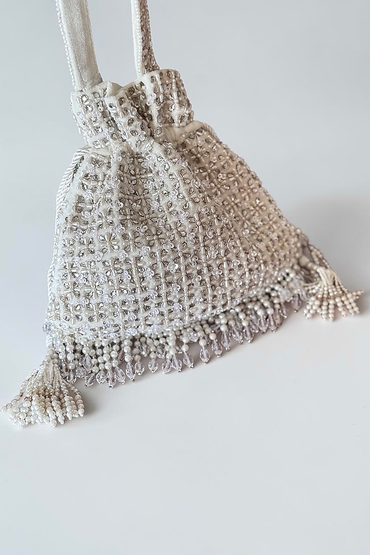 White Faux Silk Hand Embroidered Potli by BHAVNA KUMAR at Pernia's Pop Up Shop