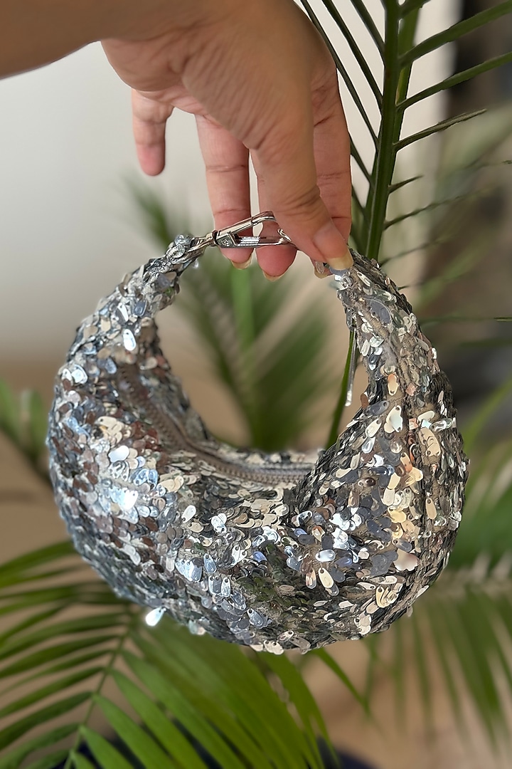 Silver Sequins Embellished Crescent Mini Bag by BHAVNA KUMAR