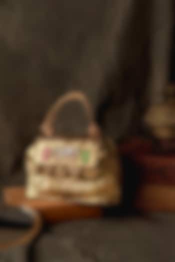 Antique Gold Crushed Fabric Kundan Sling Bag by BHAVNA KUMAR at Pernia's Pop Up Shop