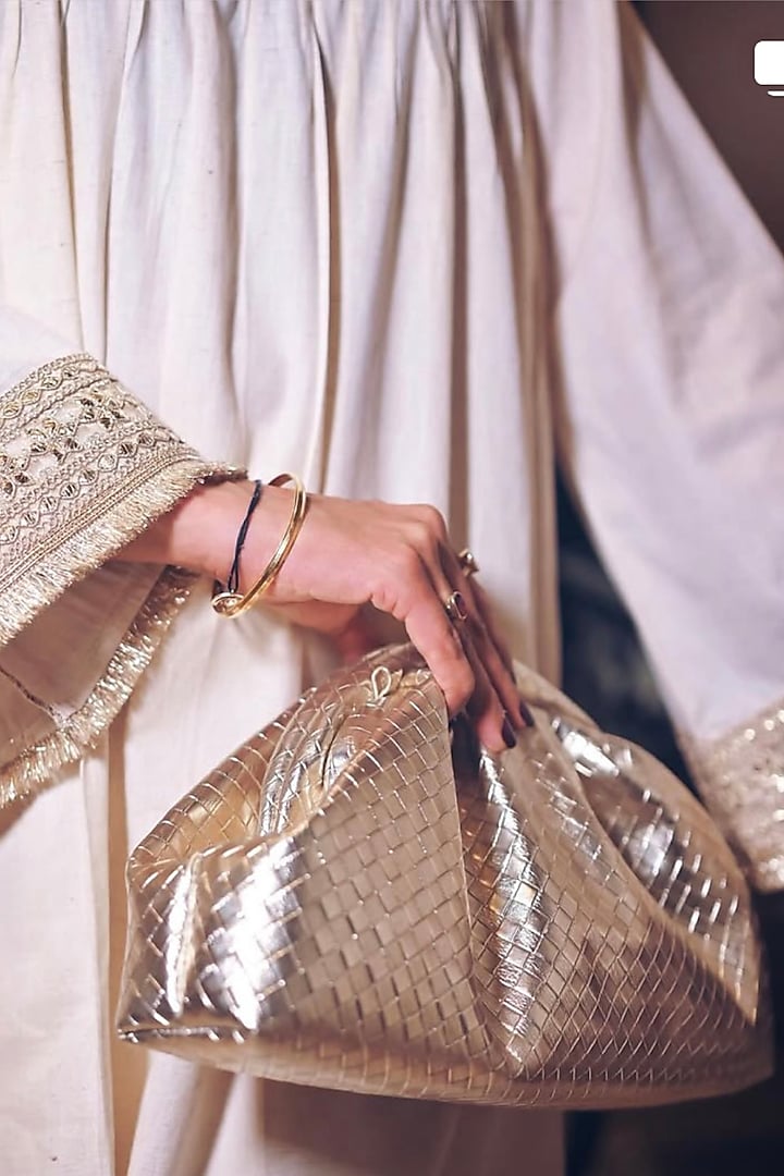 Gold Vegan Leather Puff Clutch Bag by BHAVNA KUMAR at Pernia's Pop Up Shop