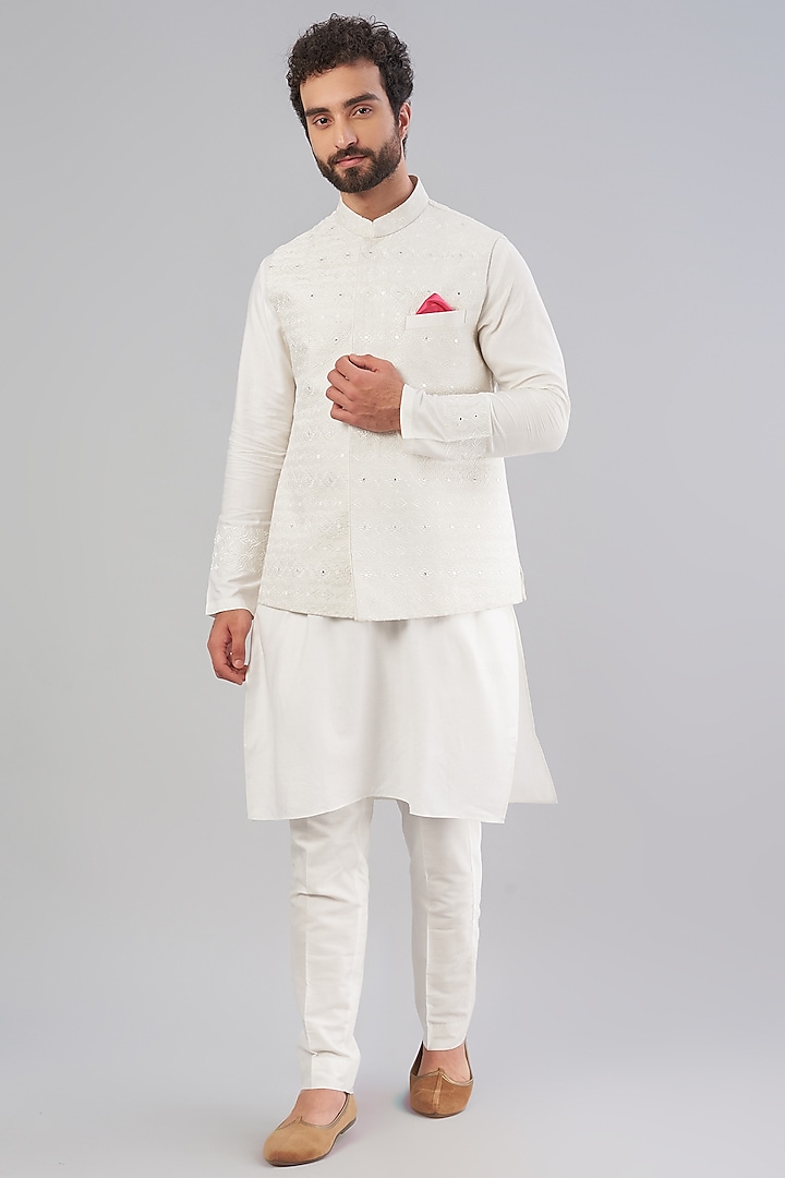 Off-White Embroidered Kurta Set With Bundi Jacket by VARENYA