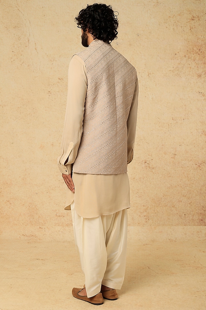 Beige Embroidered Nehru Jacket With Kurta Set by VARENYA at Pernia's Pop Up Shop