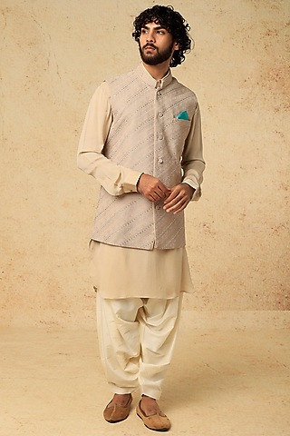 Beige Embroidered Nehru Jacket by VARENYA