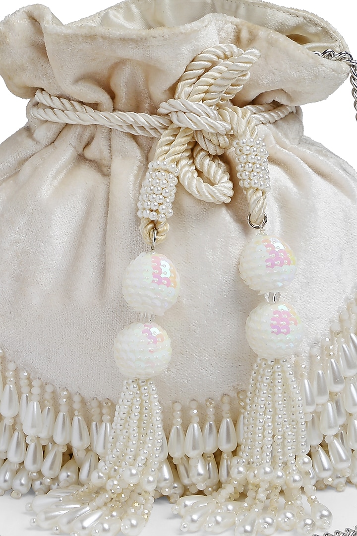 Off-White Velvet Pearl Embroidered Potli by Bijoux By Priya Chandna at Pernia's Pop Up Shop