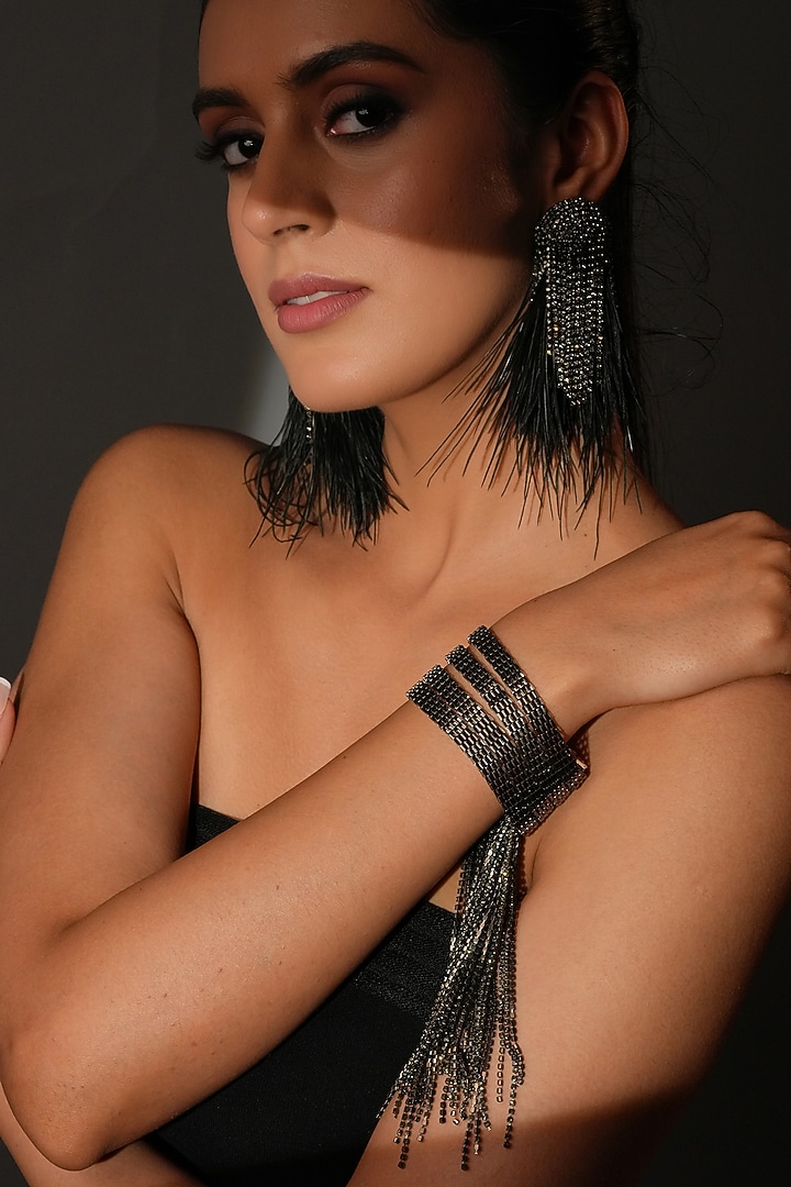 Gunmetal Finish Black Shimmering Crystal Dangling Bracelet by Bijoux By Priya Chandna at Pernia's Pop Up Shop