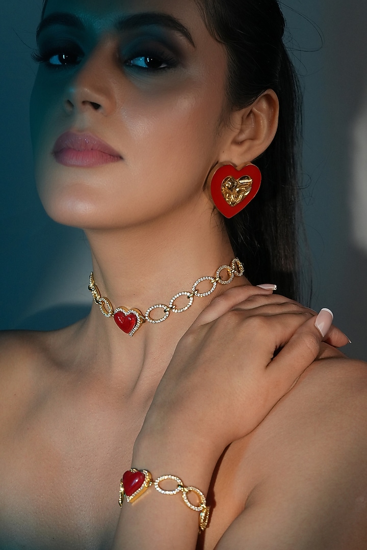 Gold Finish Red Crystal Enameled Heart Bracelet by Bijoux By Priya Chandna at Pernia's Pop Up Shop