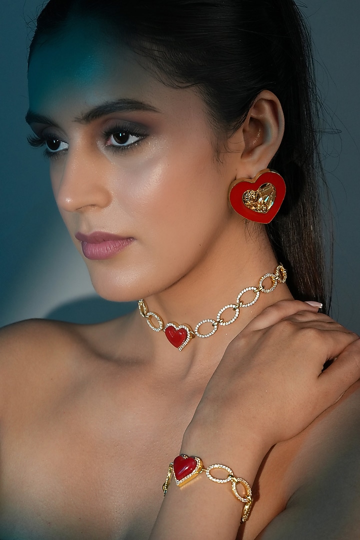Gold Finish Red Crystal Enameled Heart Bracelet by Bijoux By Priya Chandna at Pernia's Pop Up Shop
