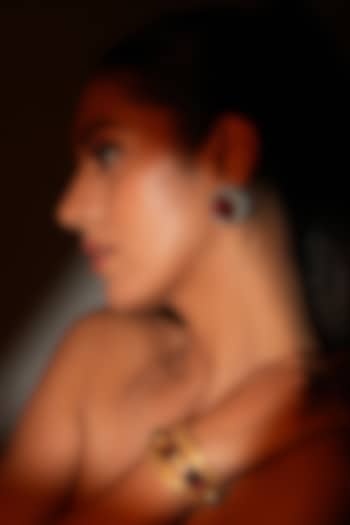 Gold Finish Metal Chain & Red Crystal Stone Sculpted Bracelet by Bijoux By Priya Chandna at Pernia's Pop Up Shop