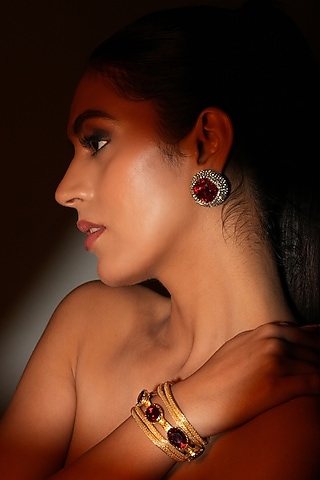 Gold Finish Metal Chain & Red Crystal Stone Sculpted Bracelet by Bijoux By Priya Chandna