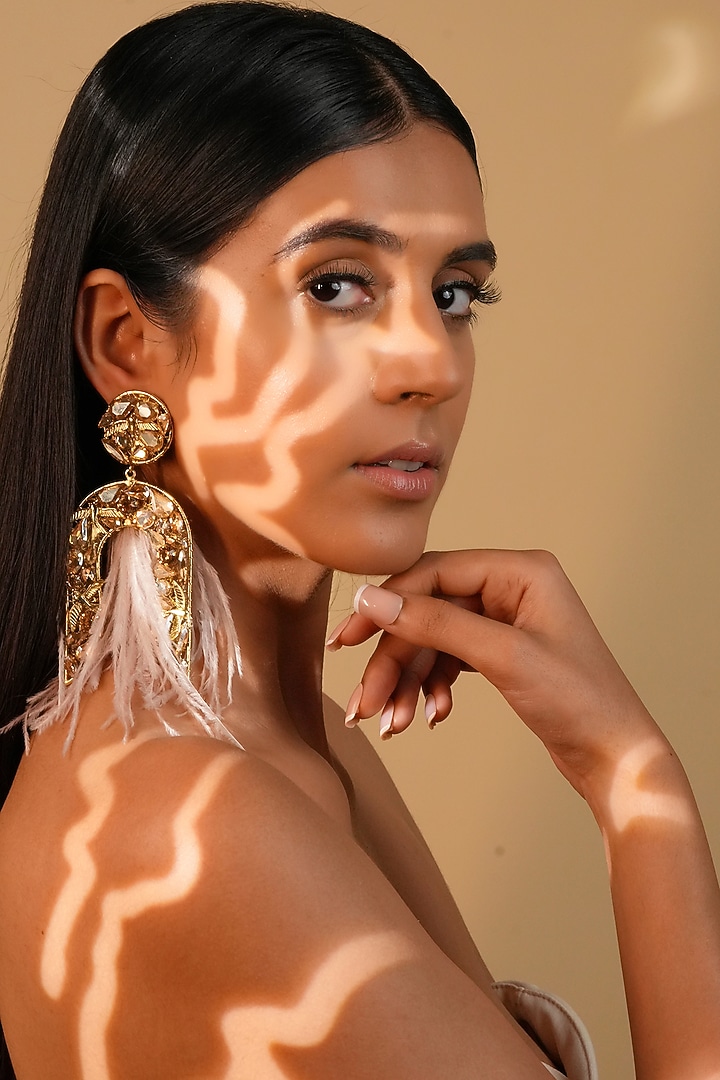 Gold Finish Ivory Feather & Crystal Dangler Earrings by Bijoux By Priya Chandna at Pernia's Pop Up Shop
