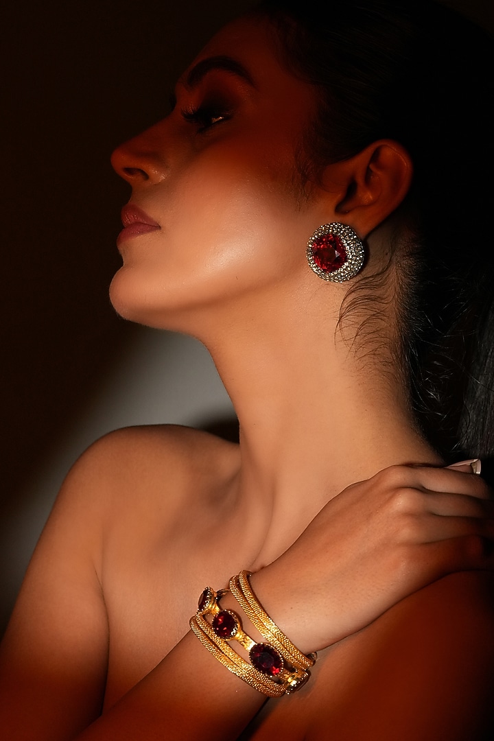 Gold Finish Deep Red Crystal Stone Stud Earrings by Bijoux By Priya Chandna at Pernia's Pop Up Shop
