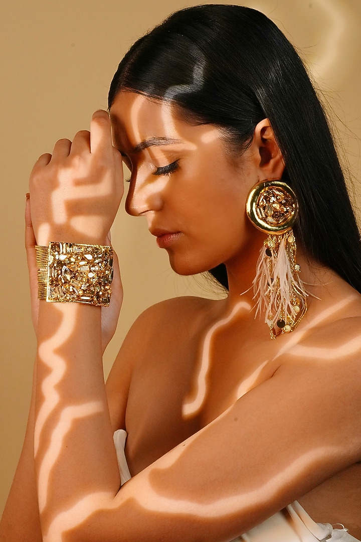 Gold Finish Crystal & Ivory Feather Dangler Earrings by Bijoux By Priya Chandna at Pernia's Pop Up Shop