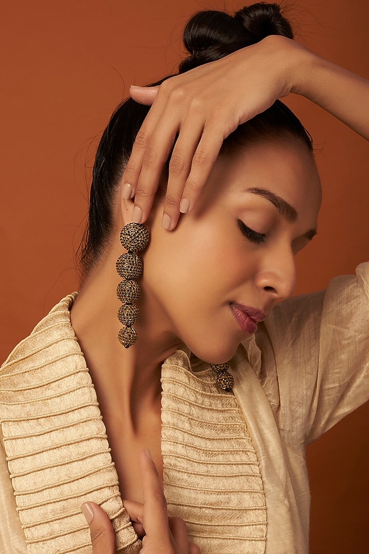 Gold Finish Dangler Earrings With Crystals by Bijoux By Priya Chandna at Pernia's Pop Up Shop