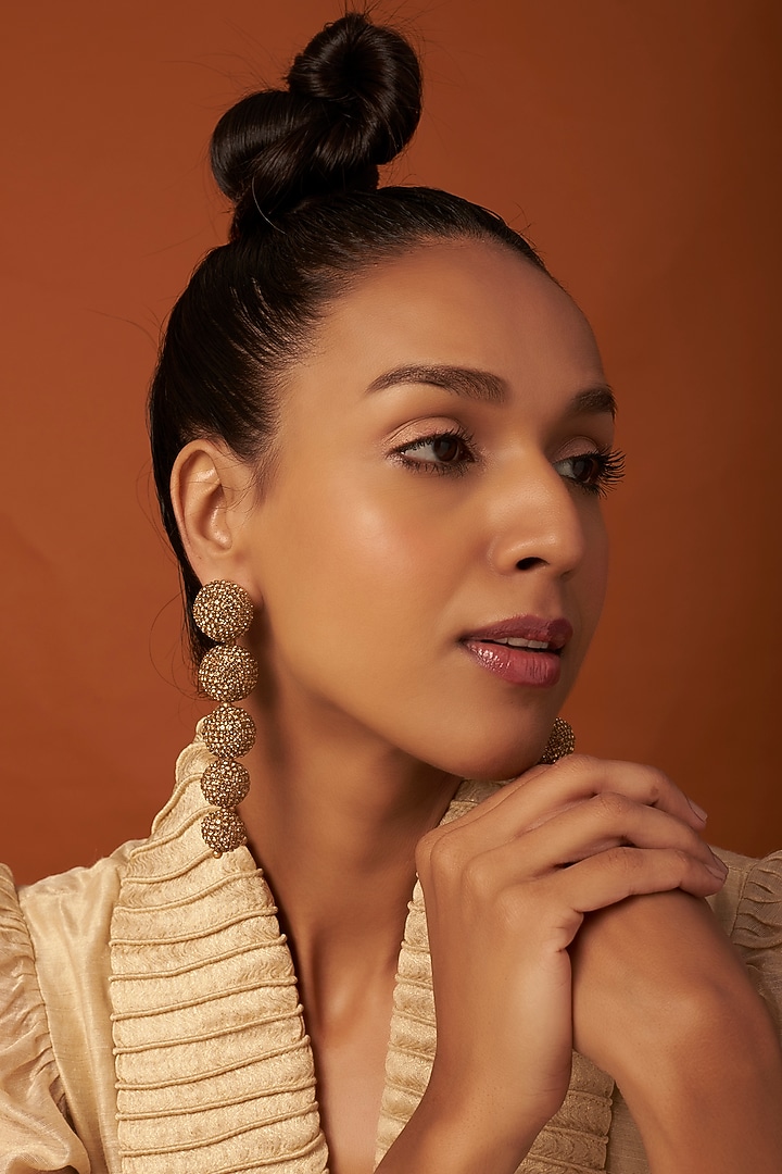 Gold Finish Dangler Earrings With Crystals by Bijoux By Priya Chandna at Pernia's Pop Up Shop