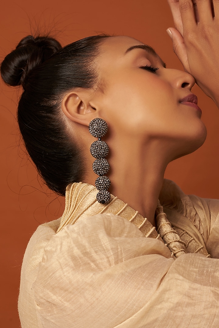 Gold Finish Dangler Earrings With Crystals by Bijoux By Priya Chandna at Pernia's Pop Up Shop
