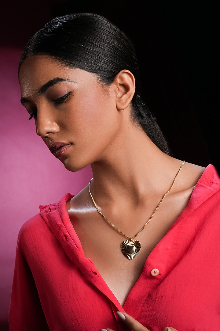 Gold Finish Crystal Spiral Heart Necklace by Bijoux By Priya Chandna at Pernia's Pop Up Shop