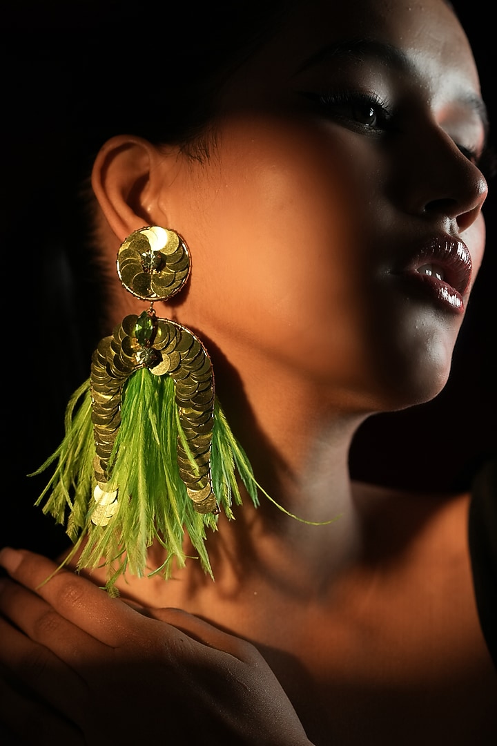 Gold Finish Sequins Work & Green Feather Tassel Dangler Earrings by Bijoux By Priya Chandna at Pernia's Pop Up Shop
